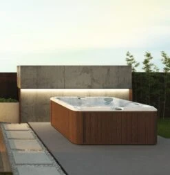 Jacuzzi® J245™ / J245IP™ - 7 Person Hot Tub -Hot Tubs Sale JHT J245 Lifestyle RoastedChestnut square