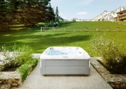 Jacuzzi® J385IP™ - 7 Person Hot Tub -Hot Tubs Sale JHT J385 Lifestyle BrushedGray V3 2000x1414 cd4d6490 eb8a 4cc8 93ff 7e2768be9789